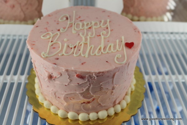 The Valentine - A red velvet cake topped with strawberry buttercream frosting. You can see the berries!